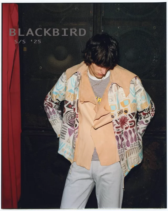 With the brand moniker of “products are made for all the people who are socially unsocialized”, the team behind Blackbird looks to remain as anonymous and socially distant as a modern clothing brand can be. Stockist profiles list them as a company run by people who have been working in the fashion industry, top fashion houses/handmade artisans type, and led by a president who utilizes his knowledge and experience accumulated through his long involvement in fashion. ¯\_(ツ)_/¯•Their S/S ’25 collection channels a garage-punk-meets-vintage-thrift-store mood, infused with the spirit of youth subcultures—gritty but with character. There’s a nostalgic callback to late-’80s/’90s underground music scenes, evident in the choice of worn textures, muted lighting, and DIY fashion cues. This combination (slide 1) includes a rustic suede vest with a woven, tapestry-like textile featuring tribal and folkloric motifs. Overshirts and loose tailoring in checked or plaid patterns use brushed cotton or wool blends, contributing to the relaxed, utilitarian layering.•Stockists like White Owl in Saitama have begun to take delivery of this collection.•View more online••styling @ kyoichi akabaphotography @youtojah hair @noritakabayashi model @tijsbutonascreen pr @yotanaka1109 #blackbird#orimonoplus
